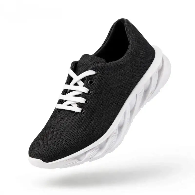 Black mesh-style men's sneakers with white laces and a white lightweight sole.