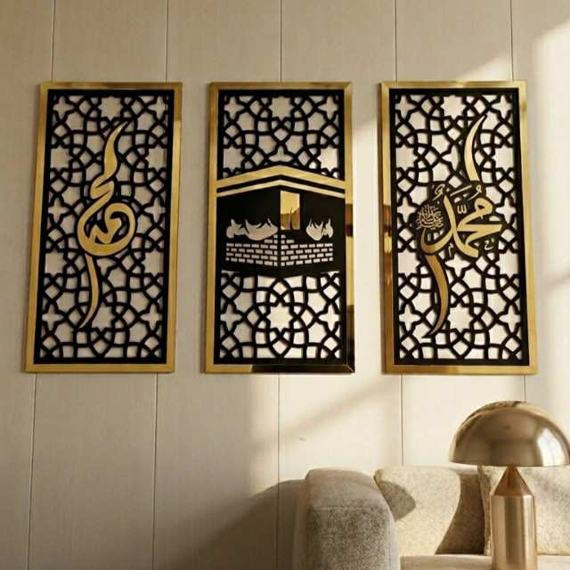 Decorative wall art panels with intricate designs on a wall.