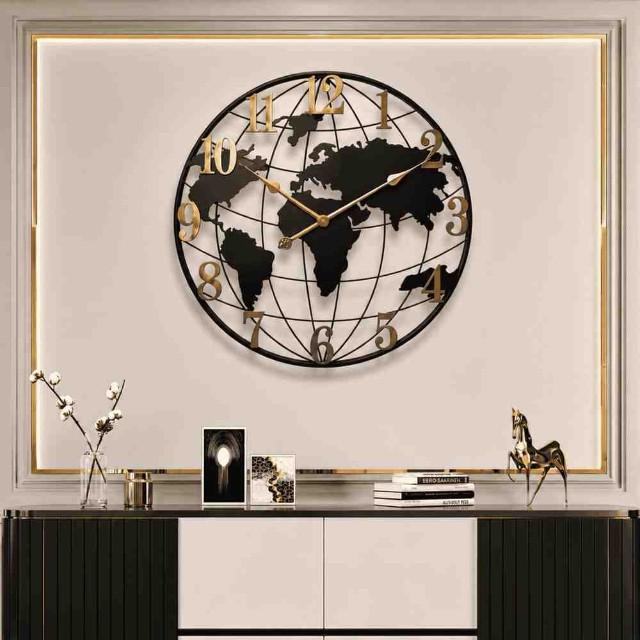 World map wall clock on a decorative wall with a console table below.