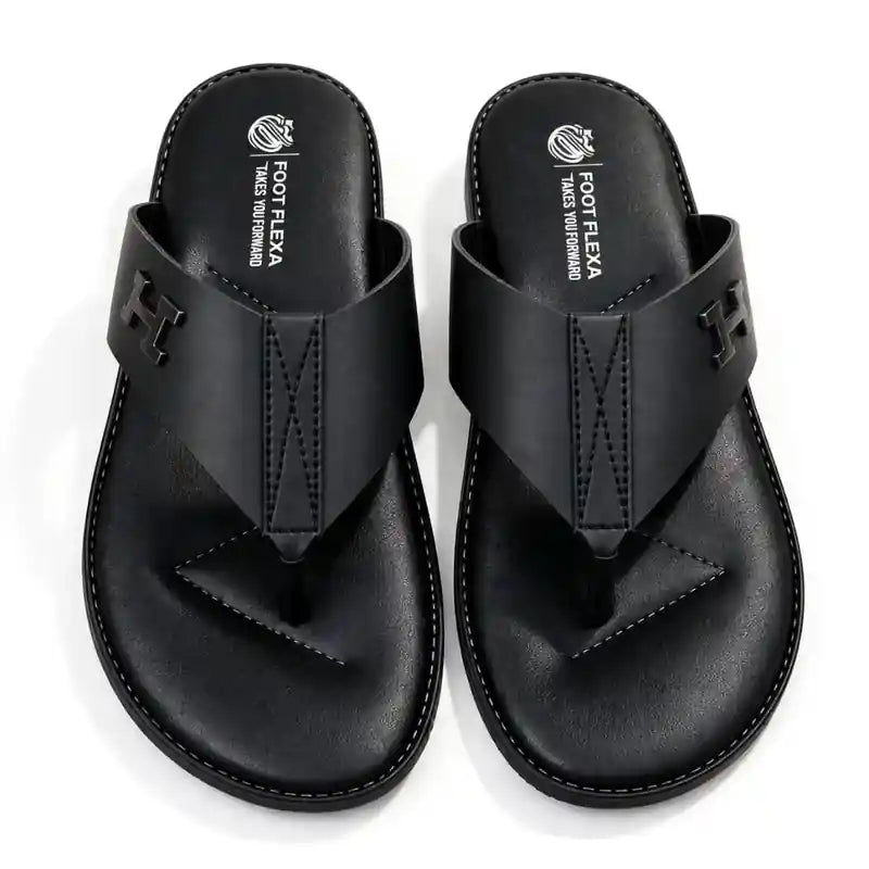 A pair of black leather thong sandals with a prominent 'H' logo on the strap, displayed from a top-down view on a white background.